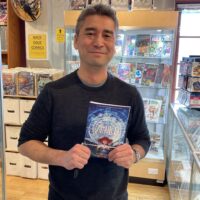 Kazu Kibiushi, writer and artist of the amazing Amulet series stopped by in February 2024 to sign a bunch of the final volumes of the series!